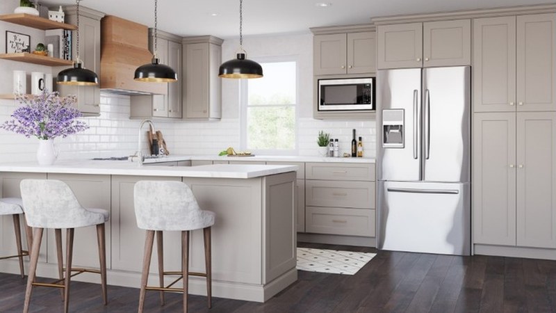 Shaker cabinetry in Beige Sand with white subway tile