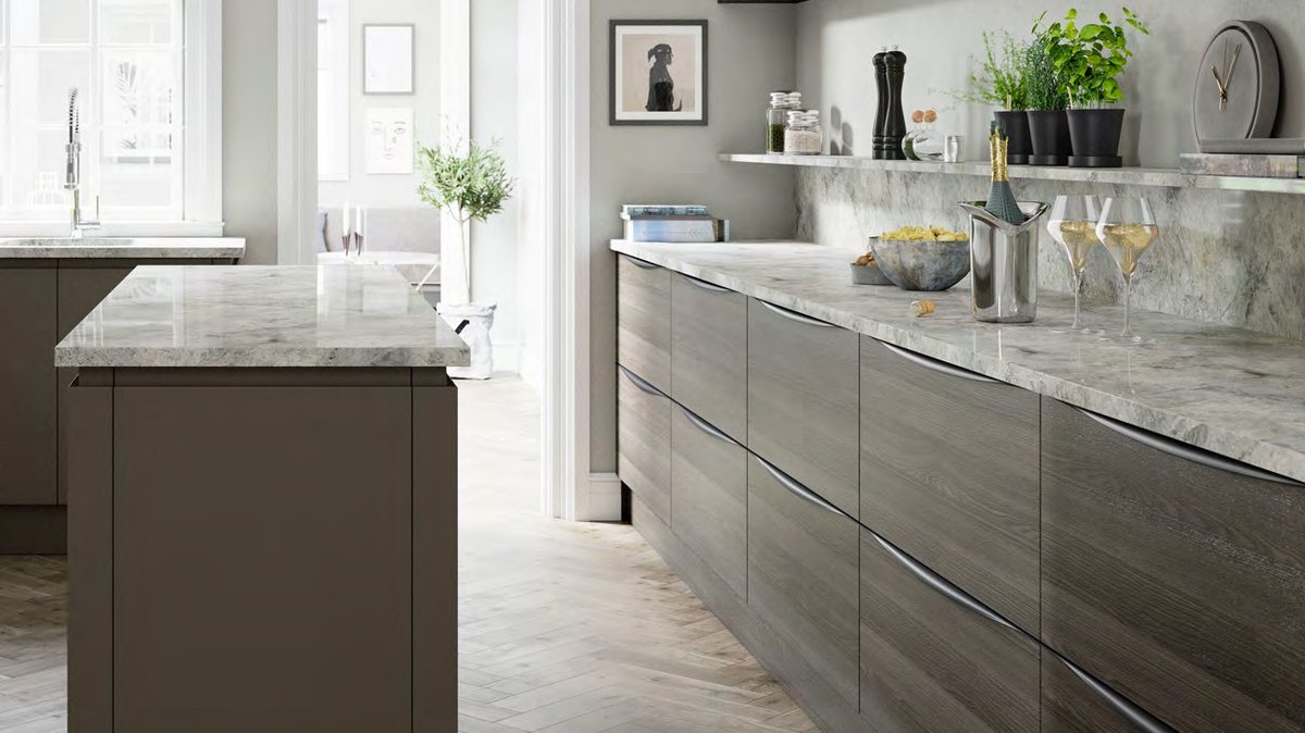 Handleless slab kitchen with a stone island