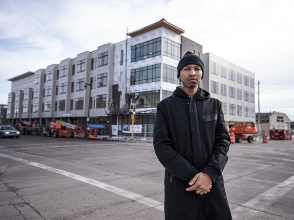 Que El-Amin at a Scott Crawford, Inc. mixed-use development under construction in Milwaukee
