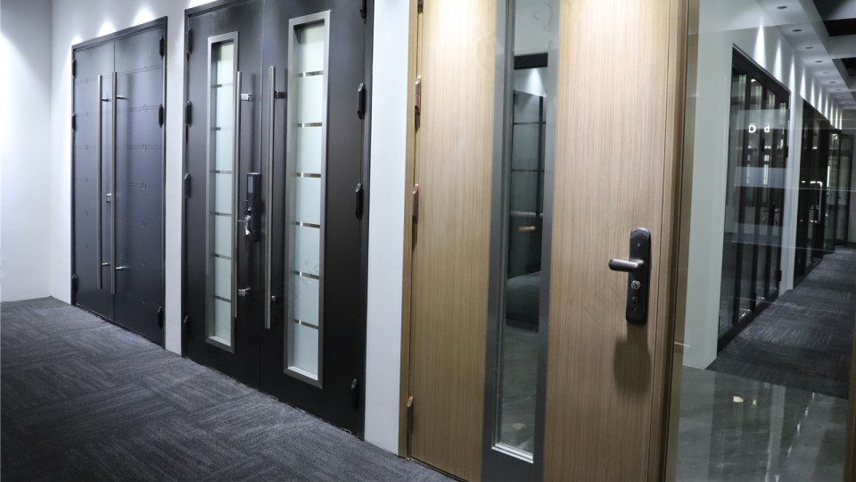 Double and single doors in dark metal and woodgrain finishes with glazed lites